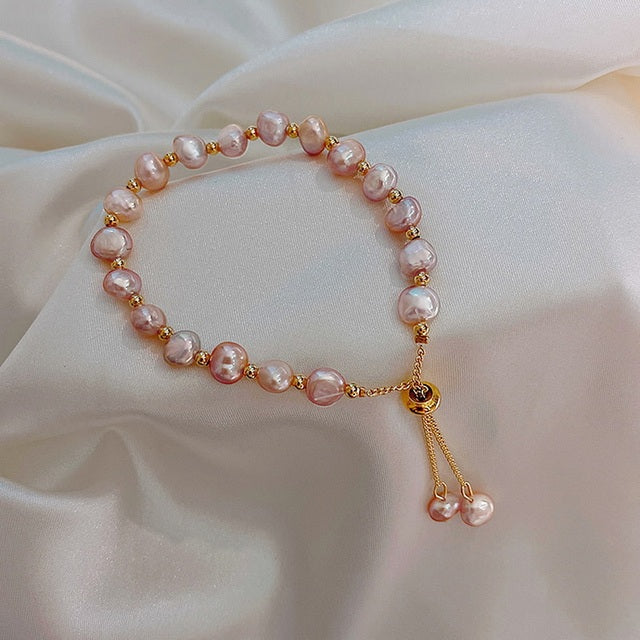 Pink pearl bracelet in gold