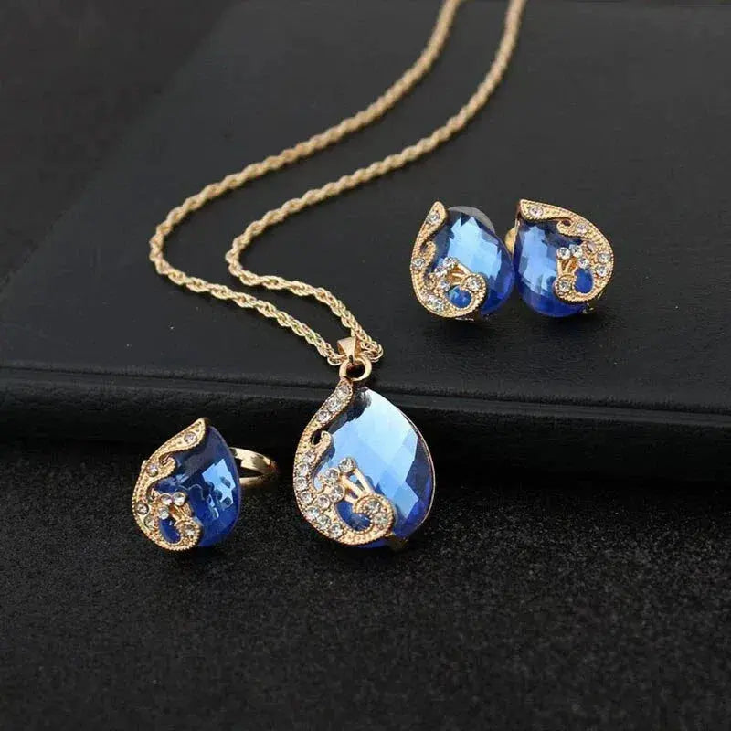 Set of necklace and earrings in blue crystal with gold