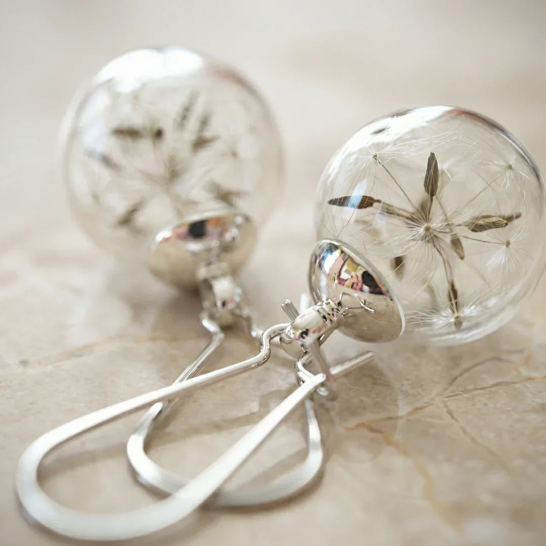 Silver earrings with dandelion