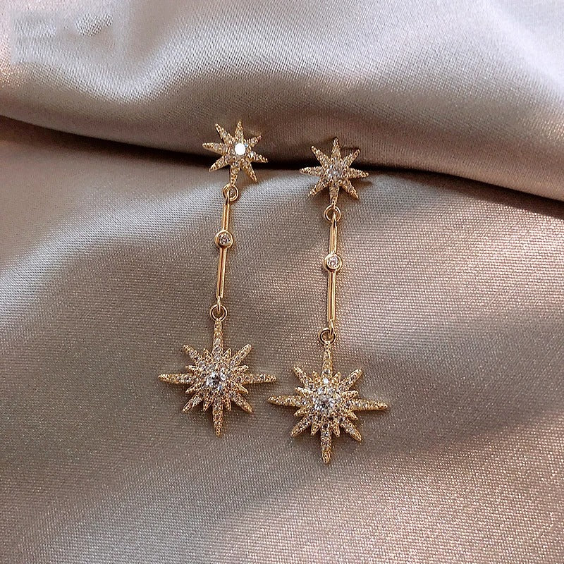 Vintage gold earrings with crystal star
