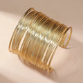 Open bracelet fitting with spiral in gold
