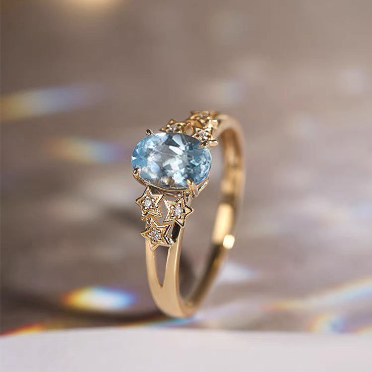 Exclusive ring in gold with blue crystal – 6