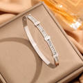 Simple geometric open bangle with two layers of zircon – image 3