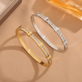 Simple geometric open bangle with two layers of zircon – Gold