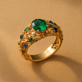 Gold ring with green and blue crystals – 17