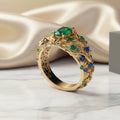 Gold ring with green and blue crystals – 18