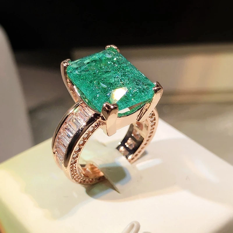 Gold ring with clear green stone – 15