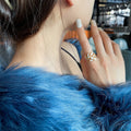 Adjustable ring with white opal in gold – image 2
