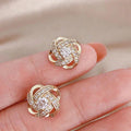 Cross earrings in flower spiral – image 3