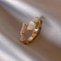 Luxurious adjustable ring with white opal stones in gold – image 2