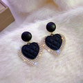 Black heart earrings in gold – image 2