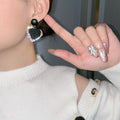 Black heart earrings in gold – image 3
