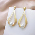 Earrings with crystals and round pearls – image 2