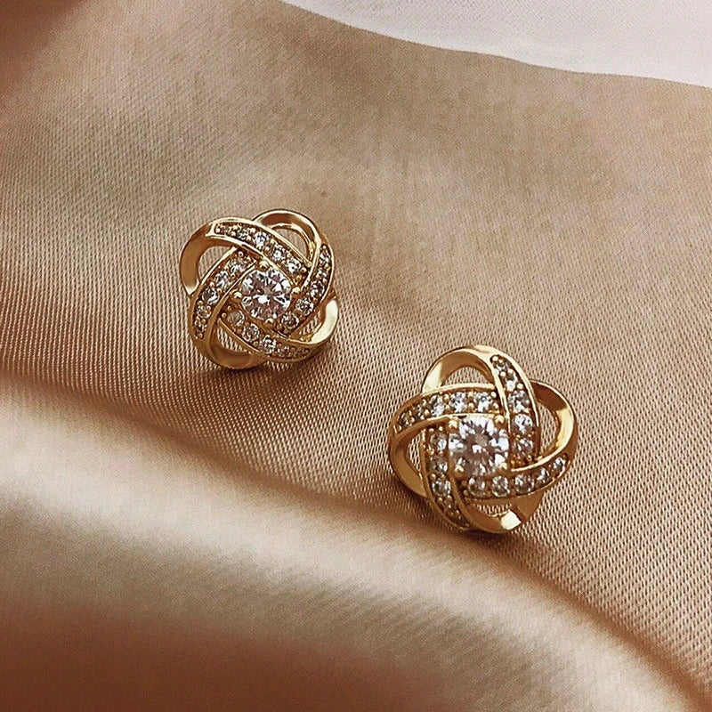 Earrings with zircon balls in gold