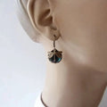 Spherical earrings with a jeweler in antique gold – Green