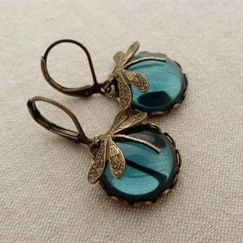 Spherical earrings with a jeweler in antique gold – Blue