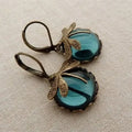 Spherical earrings with a jeweler in antique gold – Blue
