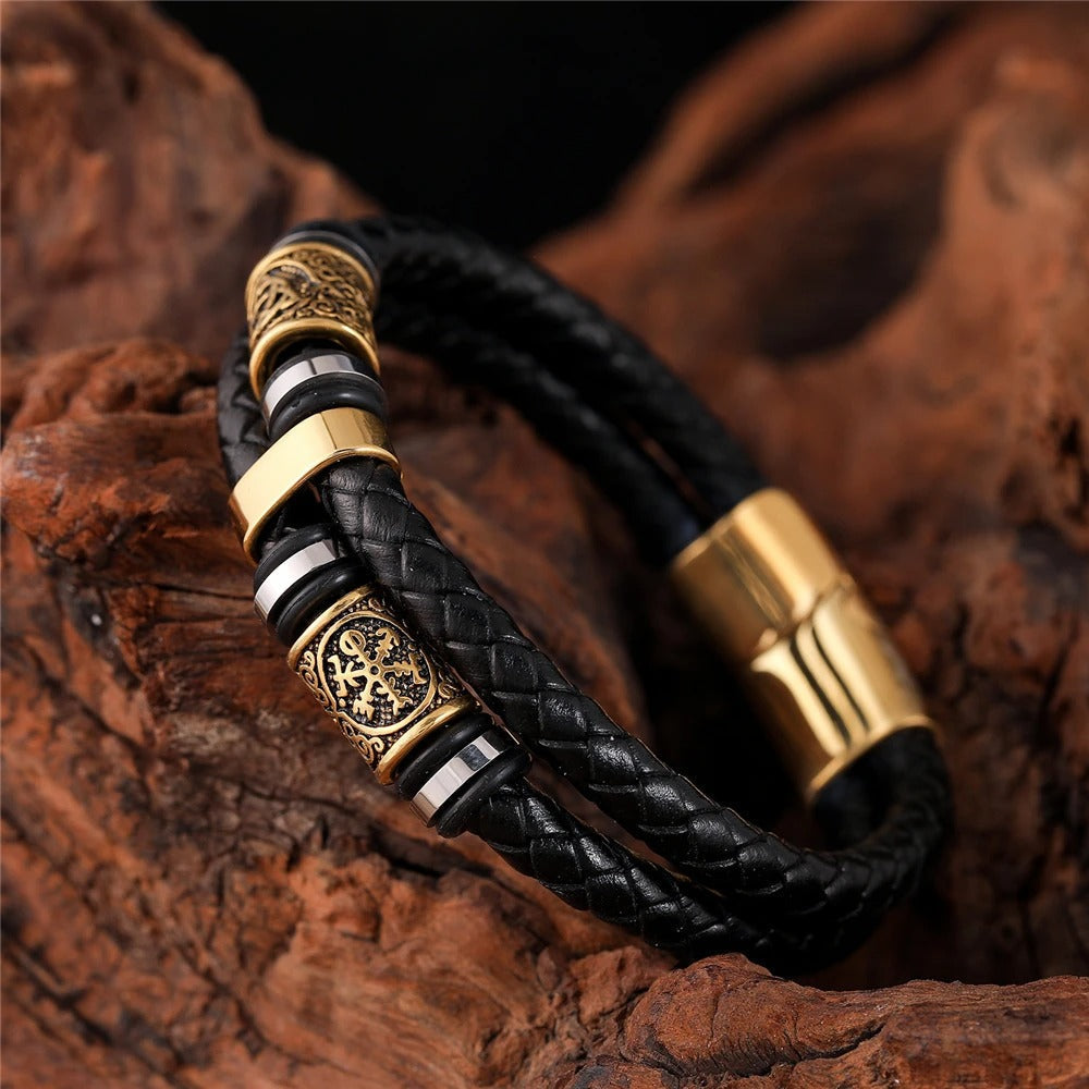 Black braided leather bracelet with gold colored pendant