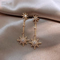 Vintage gold earrings with crystal star