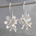 Vintage silver earrings with irregular flowers